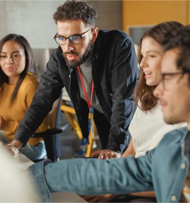 Group of people collaborating at a desk